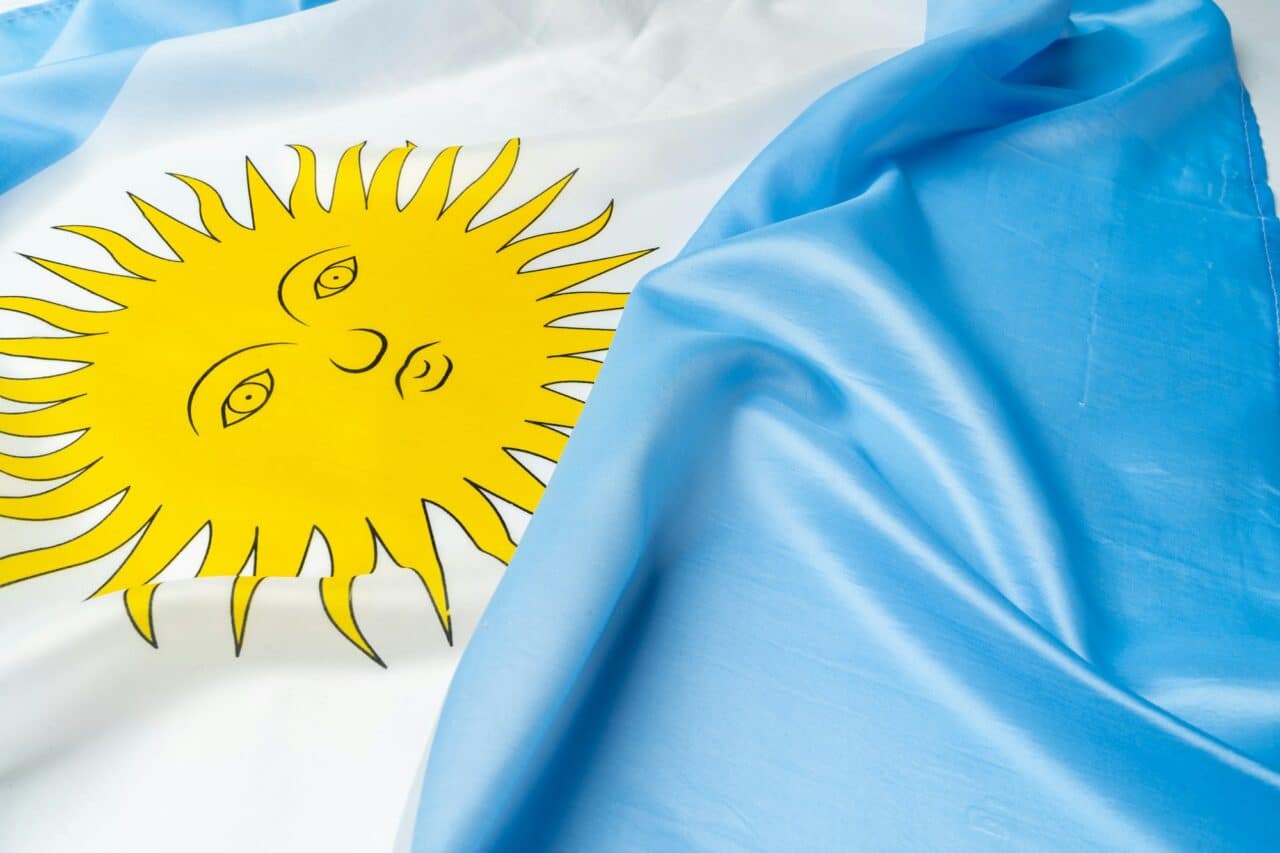 Photo of waving flag of Argentina lying on surface